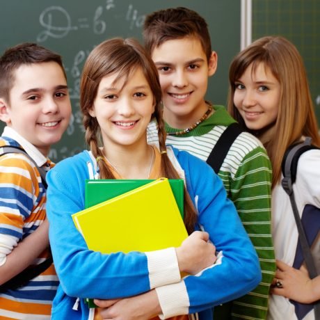 Portrait of happy teens looking at camera with smiles